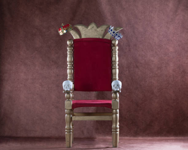 istock royal throne with skulls on a red background 1255246507