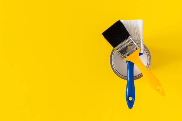 istock Can of white paint with brushes 1255249163