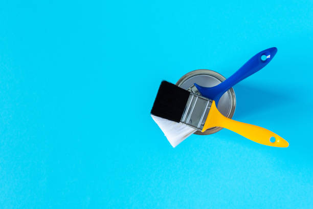 istock Can of white paint with brushes 1255249174