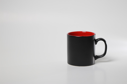 black inside red coffee cup on white isolated background