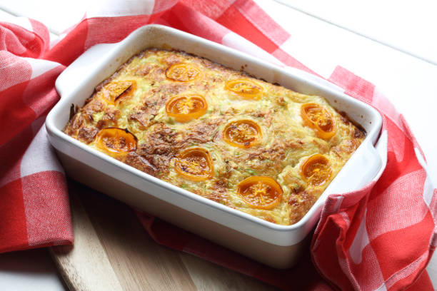 istock Zucchini and cheese casserole with yellow cherry tomatoes 1255253031