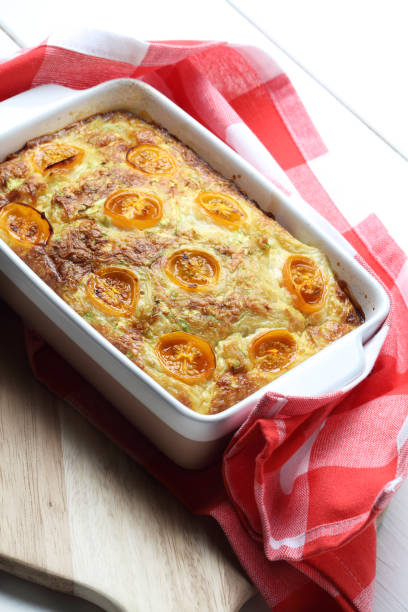 istock Zucchini and cheese casserole with yellow cherry tomatoes 1255253103
