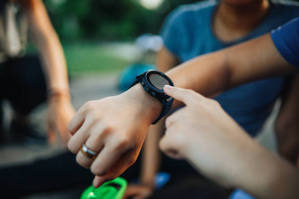 istock Young woman checking her smartwatch after workout 1255253204