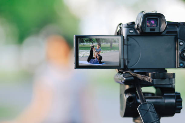 istock Young woman recording a vlog while exercising 1255257281