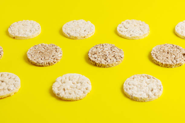 istock Rice and buckwheat cakes on yellow background. 1255257555