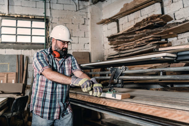 istock Mature Manual worker working with wood in carpentry. 1255258863