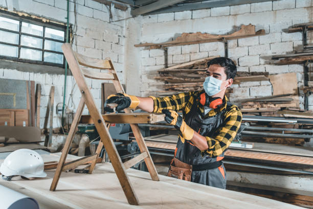 istock Young Man renewing chair, grinding. 1255259276