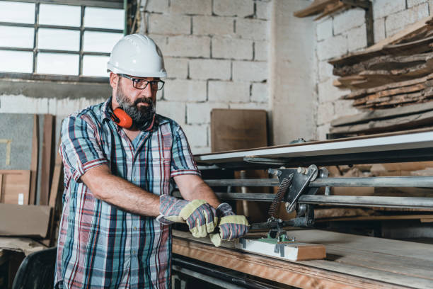 istock Mature Manual worker working with wood in carpentry. 1255259277