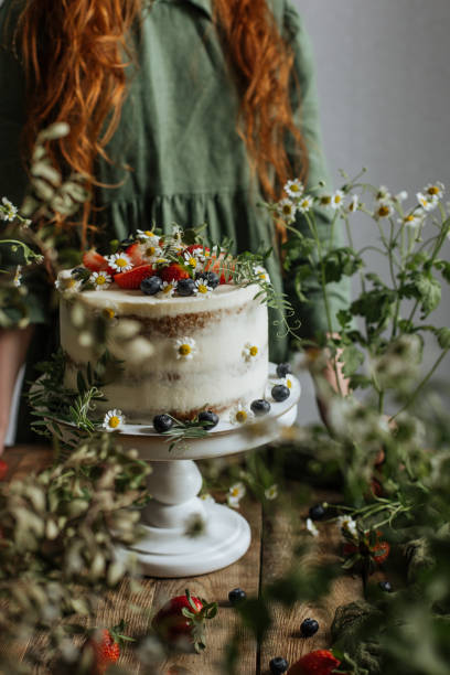 istock On the table is a cake decorated with flowers and berries 1255260424
