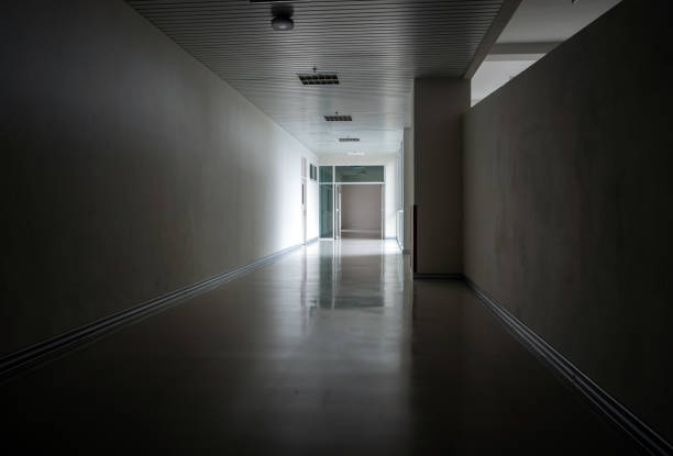 istock Light at the exit of the corridor in the building 1255261160