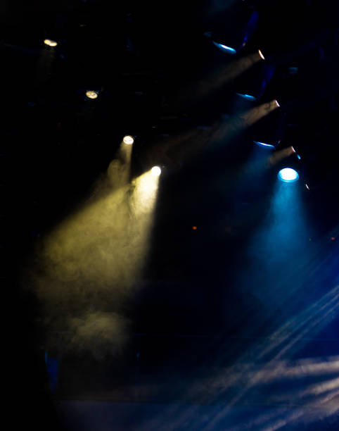istock lights spotlights and smoke over the stage 1255261399