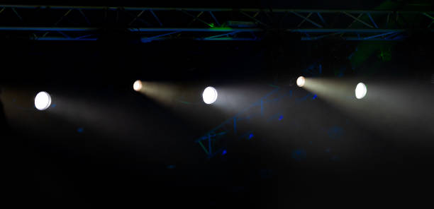 istock lights spotlights and smoke over the stage 1255261428