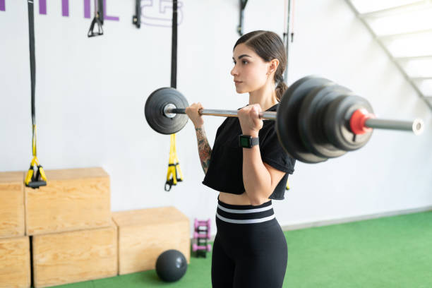 istock Athletic Woman Doing Workout With Barbell 1255263755