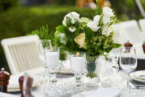 istock Decorated table with candles with beautiful bouquet 1255265327