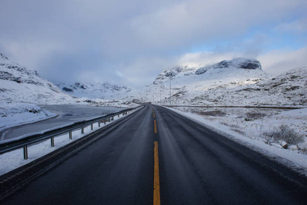 istock A Quiet Norwegian Road Heading Towards The Mountains 1255266473