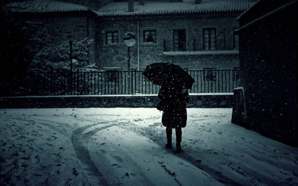 istock Woman walking in snow 1255267365