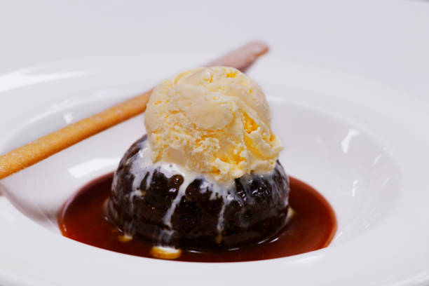 istock sticky toffee pudding with vanilla ice cream and caramel sauce 1255268223