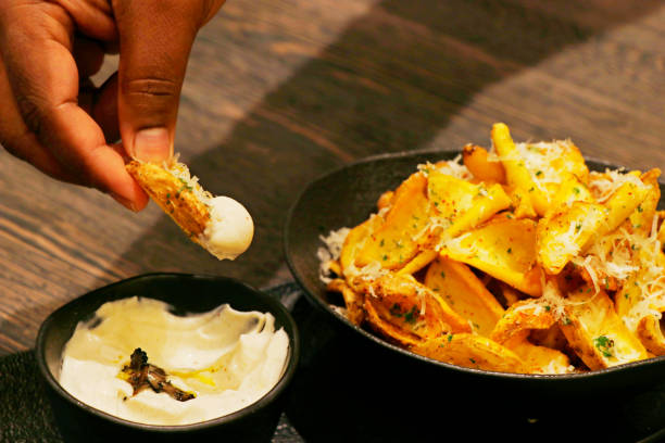istock potato chips or wedges with truffle cream dip 1255268501