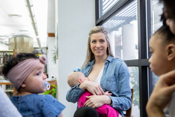 istock Women attend breastfeeding support group meeting with their infant babies 1255270744