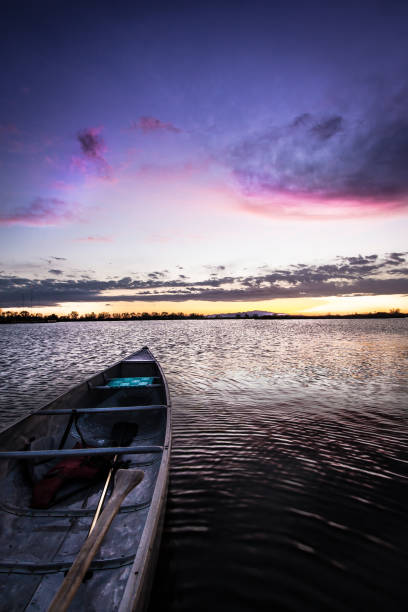 istock Canoe on a Lake at Sunset 1255271400