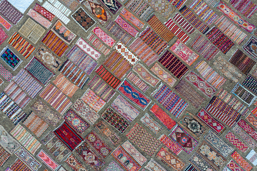 Aerial view of colourful carpets  under sunlight for accelerated ageing. Taken via drone