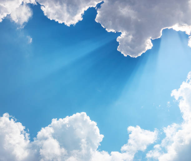 istock Sun, sunbeam and clouds in blue sky 1255274043