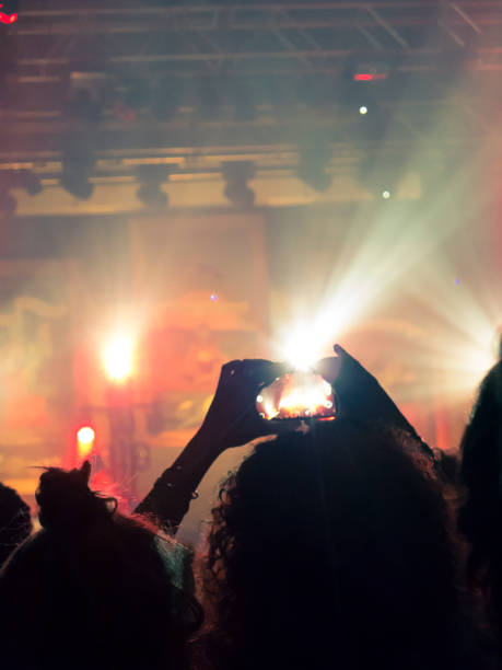 istock Filming concert on smart phone 1255275061