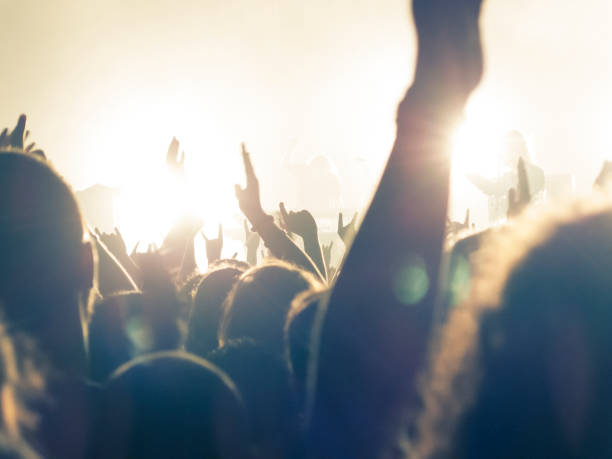 istock Concert hall with people silhouettes 1255275665