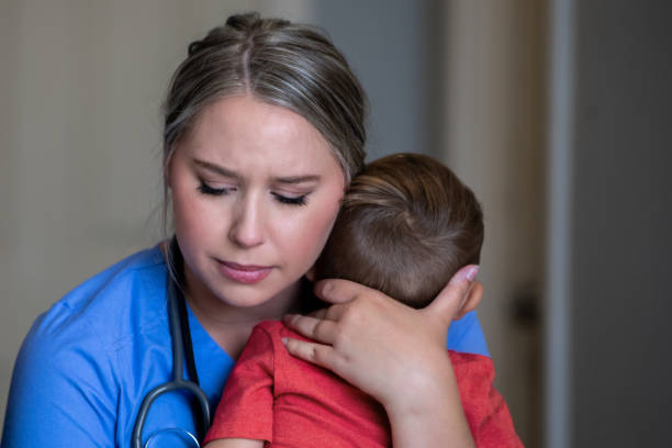 istock Mother hugs son before leaving to work during a pandemic 1255277950