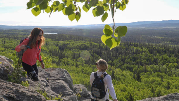 istock Female hikers walk along mountain ridge 1255279291