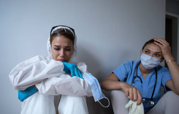istock sad women at coronavirus hospital 1255283448