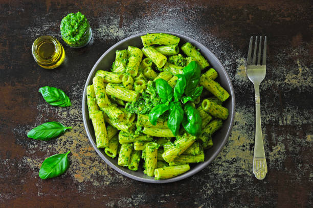 istock Italian pasta pesto with basil. Fresh vegan pesto pasta. 1255285455