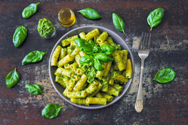 istock Italian pasta pesto with basil. Fresh vegan pesto pasta. 1255285482