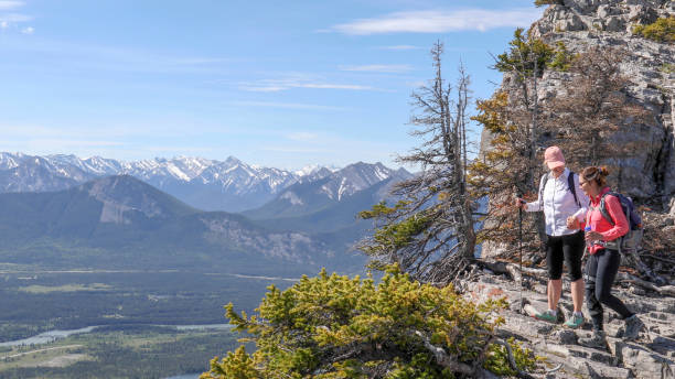 istock Female hikers walk along mountain ridge 1255285602