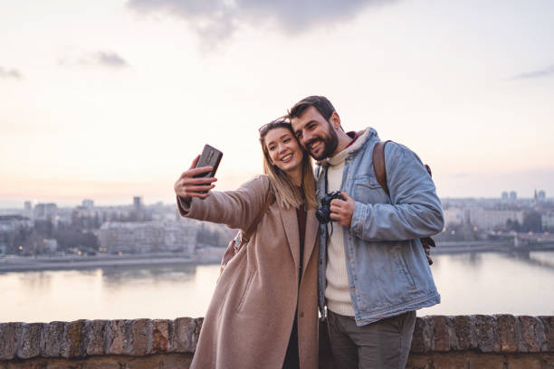 istock Cheerful young couple taking a selfie while traveling together from a fort 1255286254