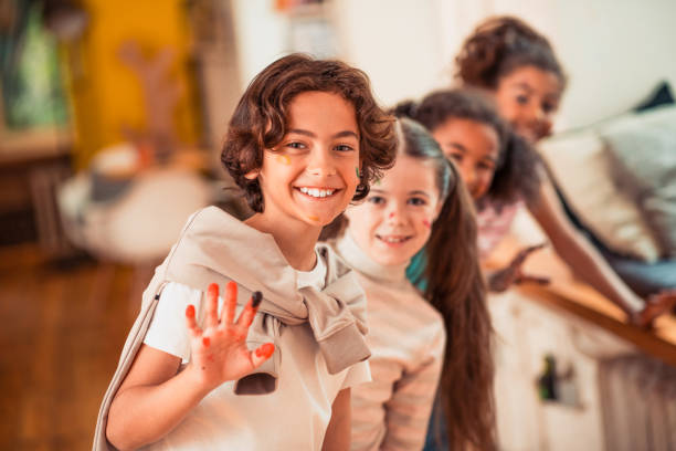 istock Children of different ethnic backgrounds are doing hand painting work 1255287099