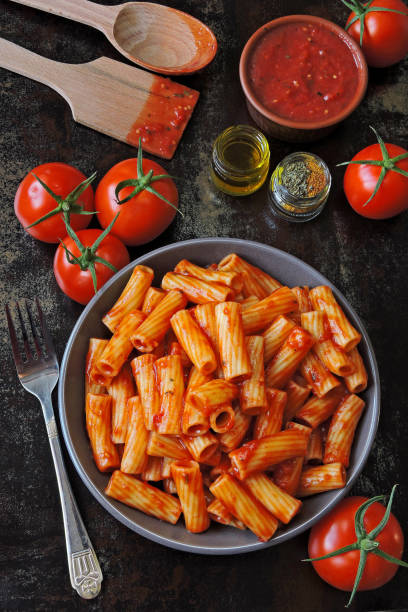 istock Appetizing Italian pasta with tomato sauce and spices. 1255287231