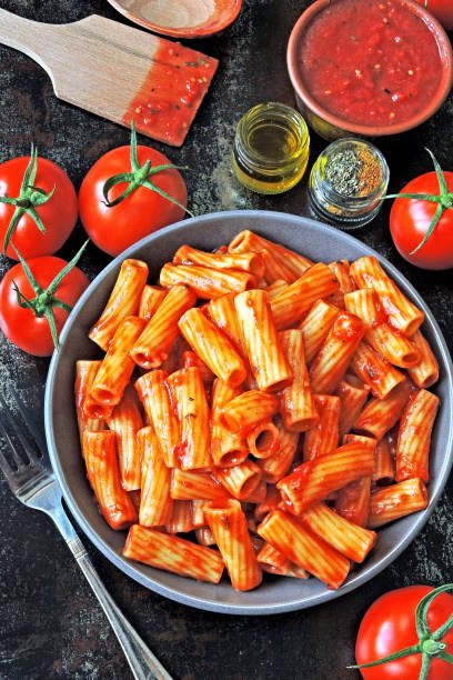 istock Appetizing Italian pasta with tomato sauce and spices. 1255287234