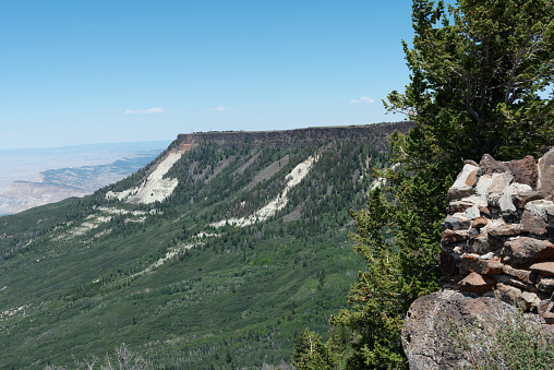 Photo looks across at part of the top of the Grand Mesa from the Lands End Observatory.