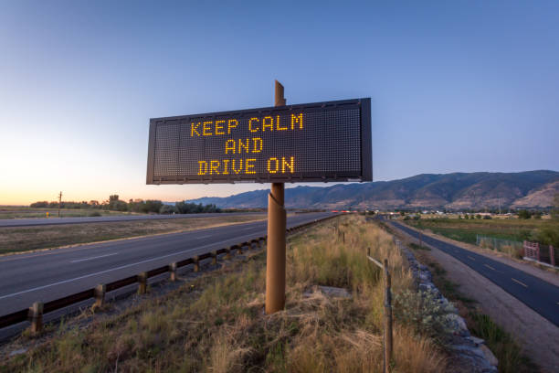 istock Keep Calm and Drive On Road Sign 1255289797