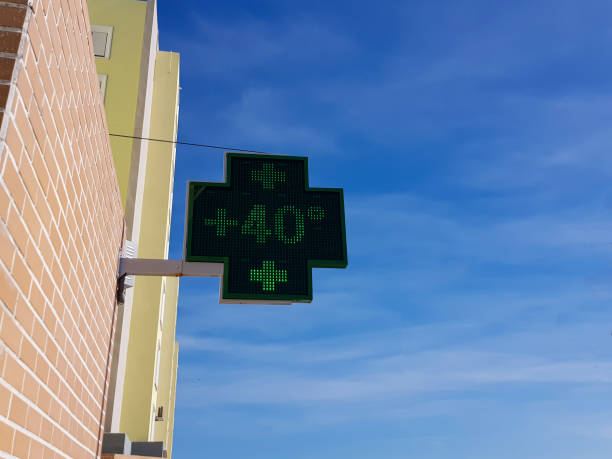 Pharmacy sign marks +40 degrees Celsius at hot day Pharmacy sign marks more than 40 degrees Celsius at hot day climate crisis photos stock pictures, royalty-free photos & images