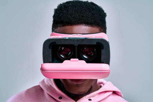 istock Pink opening virtual glasses dressed on a man. Virtual reality concept. 1255292386