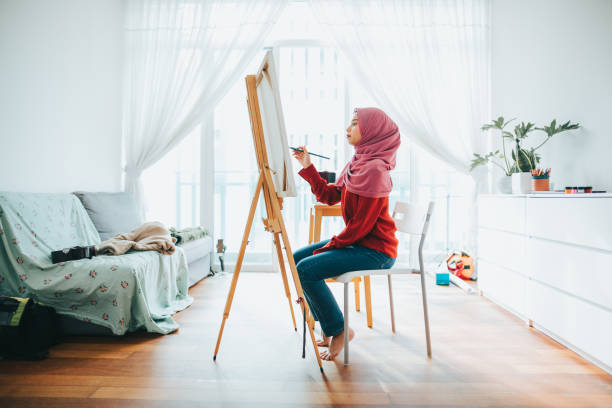 Young Asian Girl Painting Art Canvas At Home