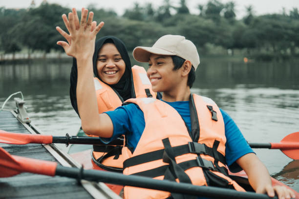 istock Asian family kayaking at river 1255302176