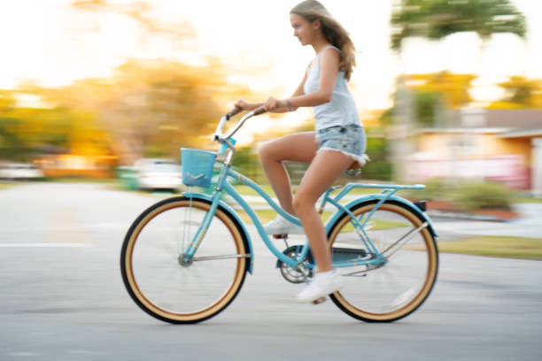 Teen cycling panning motion