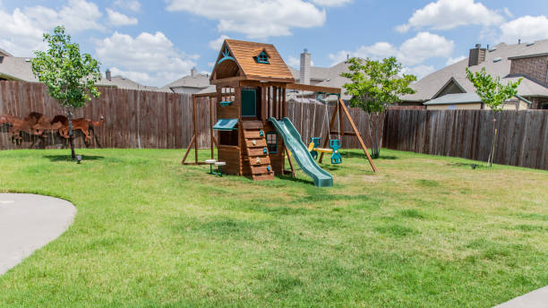 Outdoor play equipment in big backyard Outdoor play equipment in big backyard swing play equipment stock pictures, royalty-free photos & images