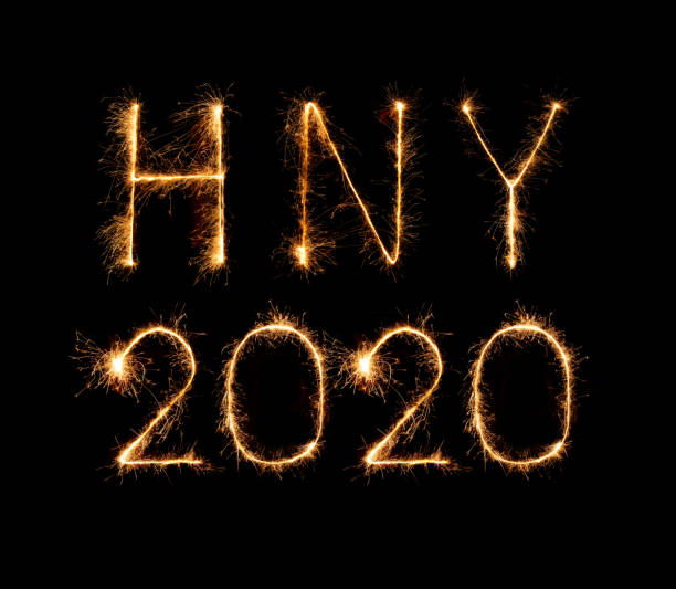 istock 2020 happy new year fireworks written sparklers at night 1255318387