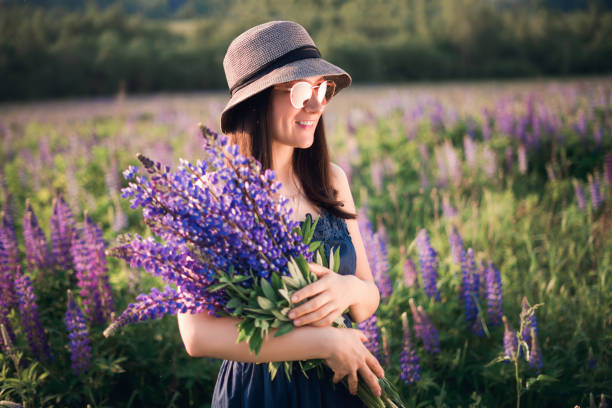 istock Girl with lupins 1255324685