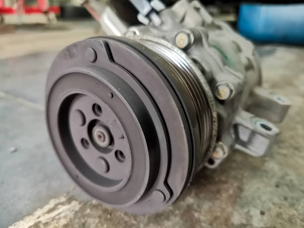 Car airconditioner compressor magnetic clutch pulley This is an image of compressor. compressor photos stock pictures, royalty-free photos & images