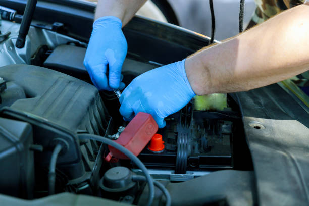 istock Engineering mechanic replacement car battery car service with wrench 1255326626